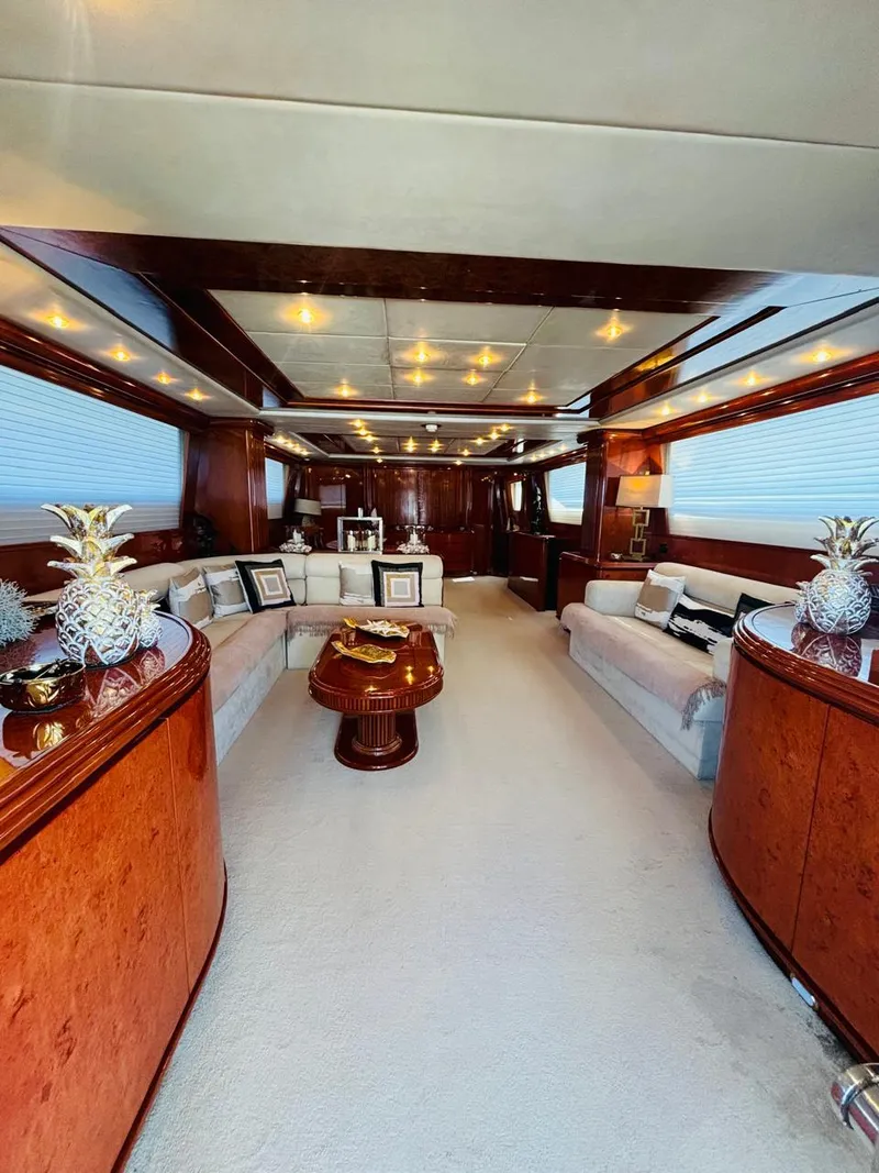 Slide: The Image of Luxurious interior of a 2000 Falcon Motoryacht with elegant wood finishes and plush seating. - 15