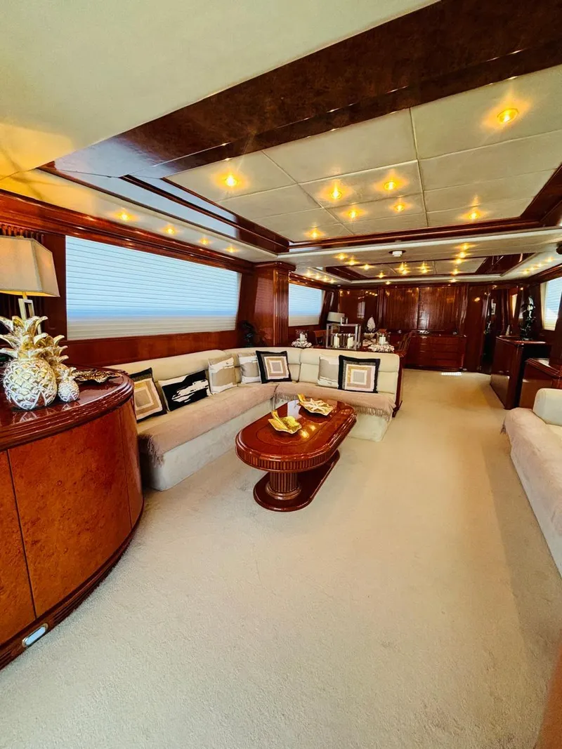 Slide: The Image of Luxurious interior of a 2000 Falcon Motoryacht with elegant wood finishes and plush seating. - 16