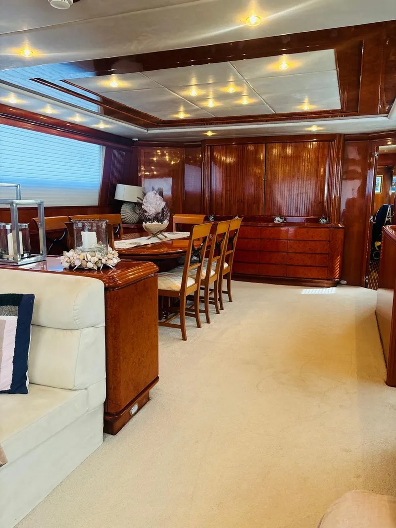 Slide: The Image of Luxurious interior of 2000 Falcon Motoryacht with elegant wood finishes and dining area. - 20