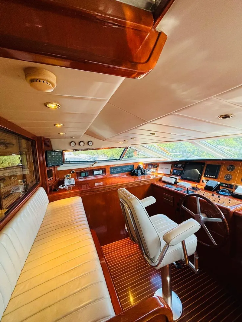 Slide: The Image of Luxurious Falcon Motoryacht 2000 cockpit with plush seating and advanced navigation controls. - 26