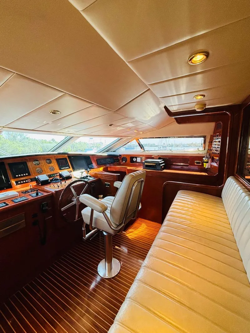Slide: The Image of Luxurious Falcon Motoryacht 2000 interior with leather seating and advanced navigation controls. - 27