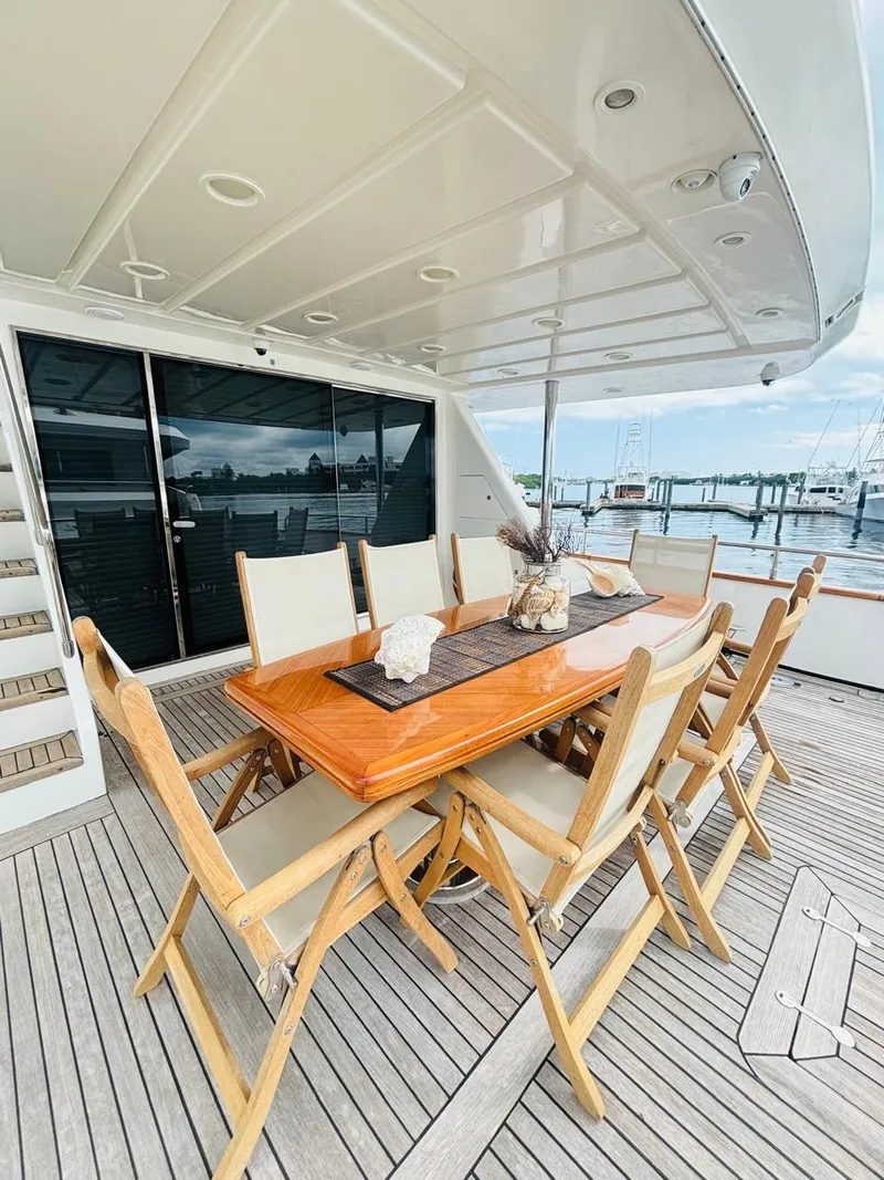 Slide: The Image of Spacious deck of 2000 Falcon Motoryacht with elegant outdoor dining setup. - 3