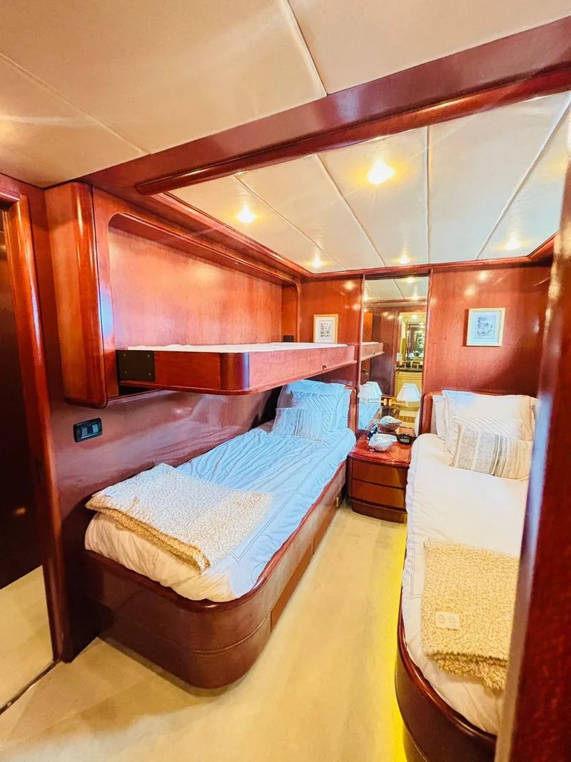 Slide: The Image of Luxurious Falcon Motoryacht 2000 cabin with wooden interior and cozy twin beds. - 47