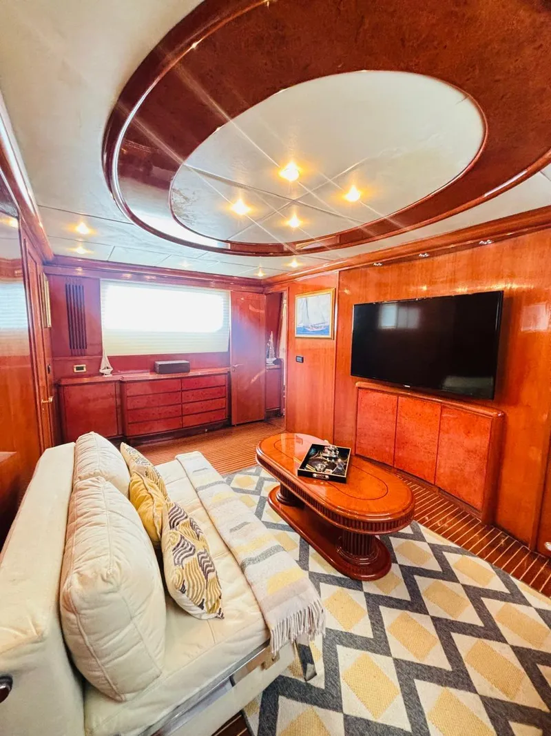 Slide: The Image of Luxurious Falcon Motoryacht 2000 interior with elegant wood paneling and modern furnishings. - 49