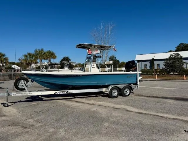 Slide: The Image of 2021 Bulls Bay 2200 boat on trailer, parked outdoors under clear blue sky. - 0
