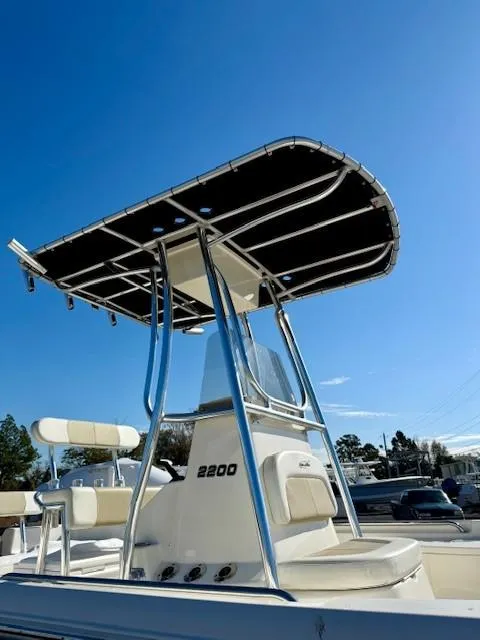Slide: The Image of 2021 Bulls Bay 2200 boat with T-top under clear blue sky. - 3