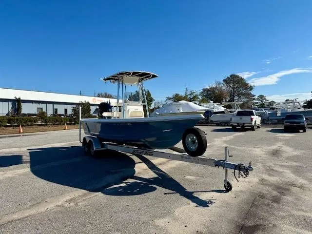 Slide: The Image of 2021 Bulls Bay 2200 boat on trailer in parking lot under clear blue sky. - 4