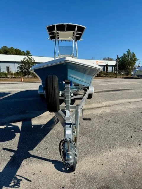 Slide: The Image of 2021 Bulls Bay 2200 boat on trailer, parked outdoors under clear blue sky. - 5