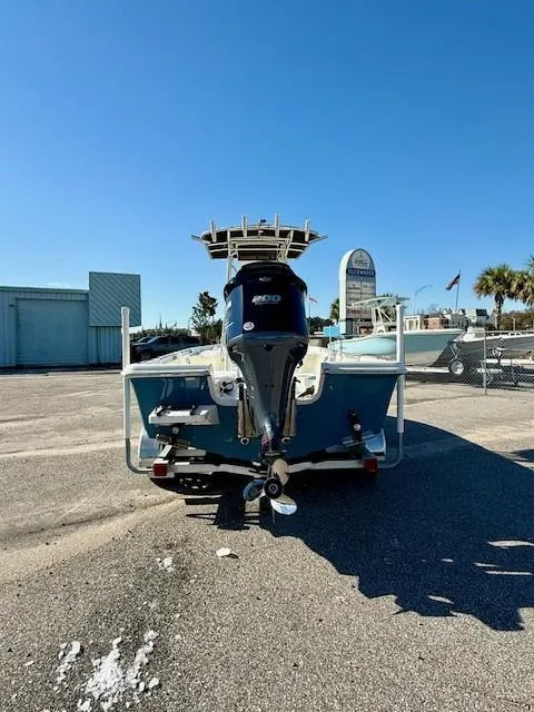 Slide: The Image of 2021 Bulls Bay 2200 boat with outboard motor, parked on asphalt under clear blue sky. - 7