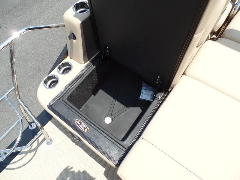 Slide: The Image of 2025 Harris SUNLINER SP 250 boat seat storage compartment with cup holders. - 16