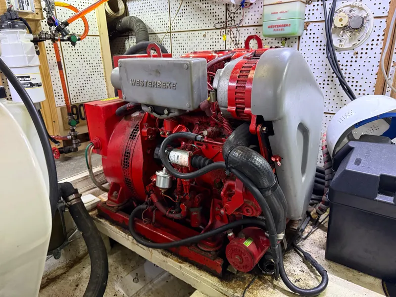 Slide: The Image of Engine room of a 1986 Jefferson Sundeck with a Westerbeke generator. - 14