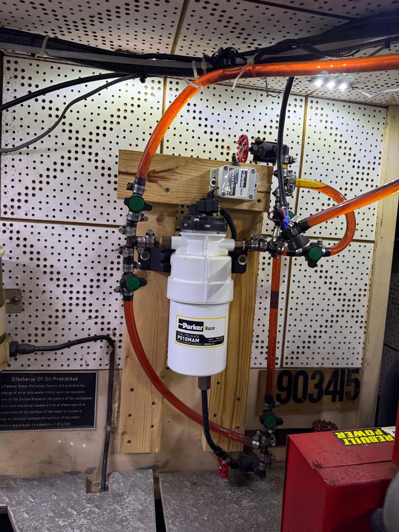 Slide: The Image of Engine room of 1986 Jefferson Sundeck with Parker Racor fuel filter system. - 17