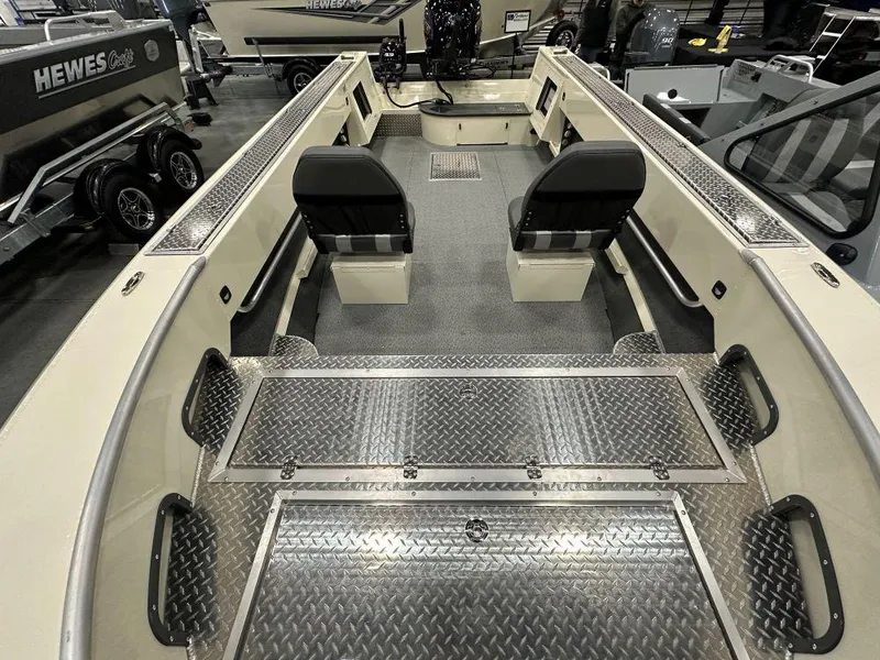 Slide: The Image of 2025 Hewescraft 200 Pioneer boat interior with dual seats and diamond plate flooring. - 3