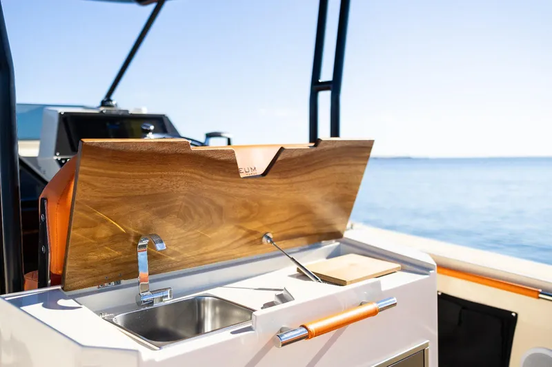 Slide: The Image of Outdoor kitchen on AlCustom LIPARI 31 boat, 2025 model, with sink and wooden cover. - 15