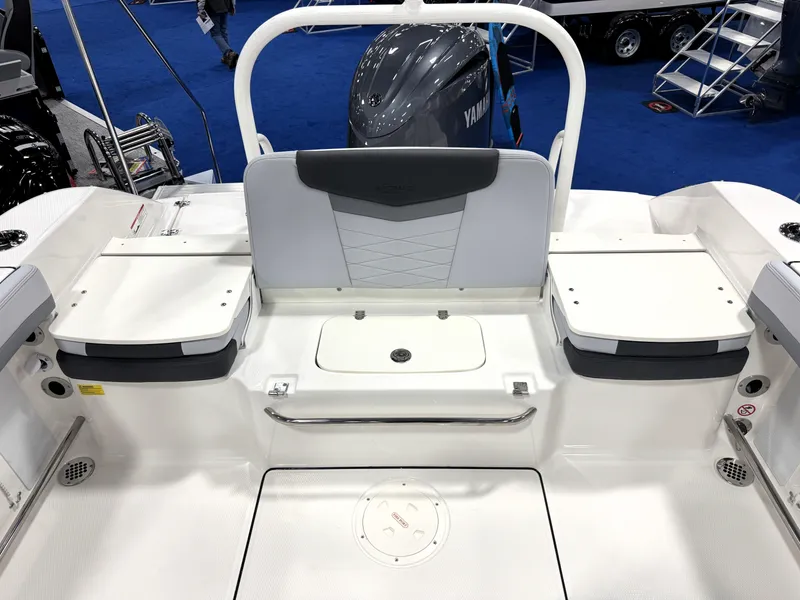 Slide: The Image of 2025 Robalo R207 Dual Console boat interior with seating and storage compartments. - 7