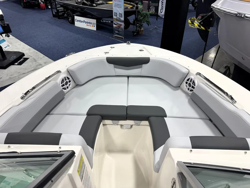 Slide: The Image of 2025 Robalo R207 Dual Console boat interior with cushioned seating and speakers. - 14