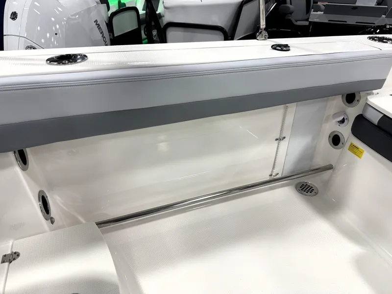 Slide: The Image of 2025 Robalo R207 Dual Console boat interior, featuring sleek seating and modern design elements. - 19