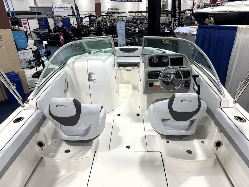 Slide: The Image of 2025 Robalo R207 Dual Console boat interior with steering wheel and seating. - 21