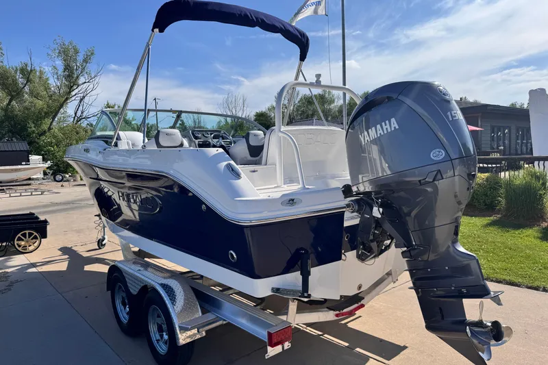 Slide: The Image of 2025 Robalo R207 Dual Console boat with Yamaha engine on trailer. - 4