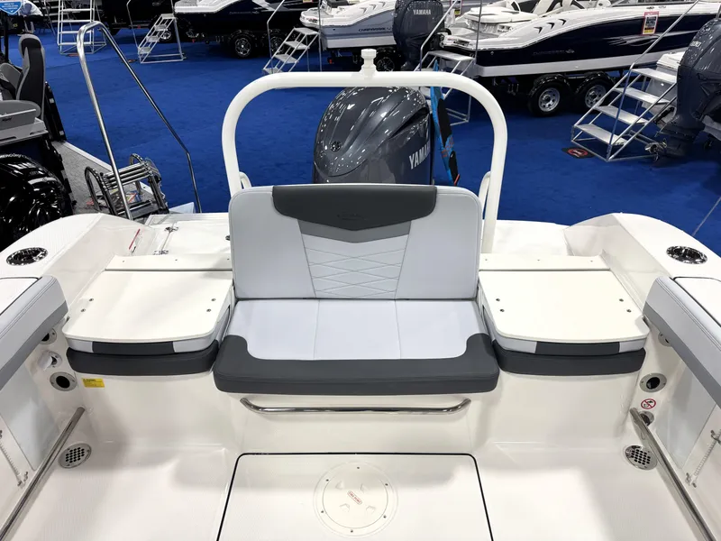 Slide: The Image of 2025 Robalo R207 Dual Console boat interior with seating and Yamaha engine. - 6