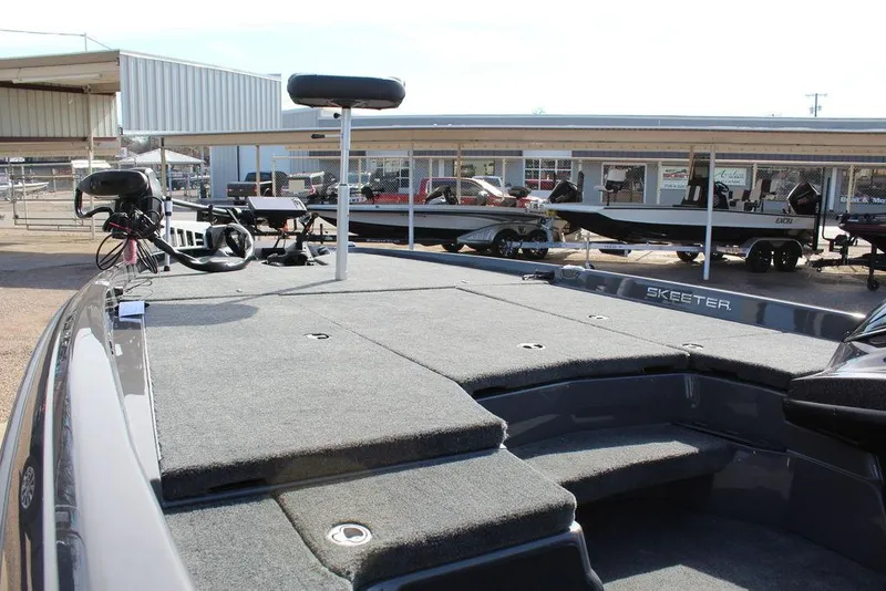 Slide: The Image of 2025 Skeeter ZXR21 fishing boat deck with seating and equipment. - 14