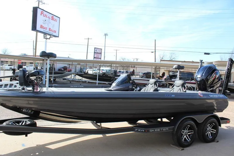 Slide: The Image of 2025 Skeeter ZXR21 boat on trailer at dealership. - 7