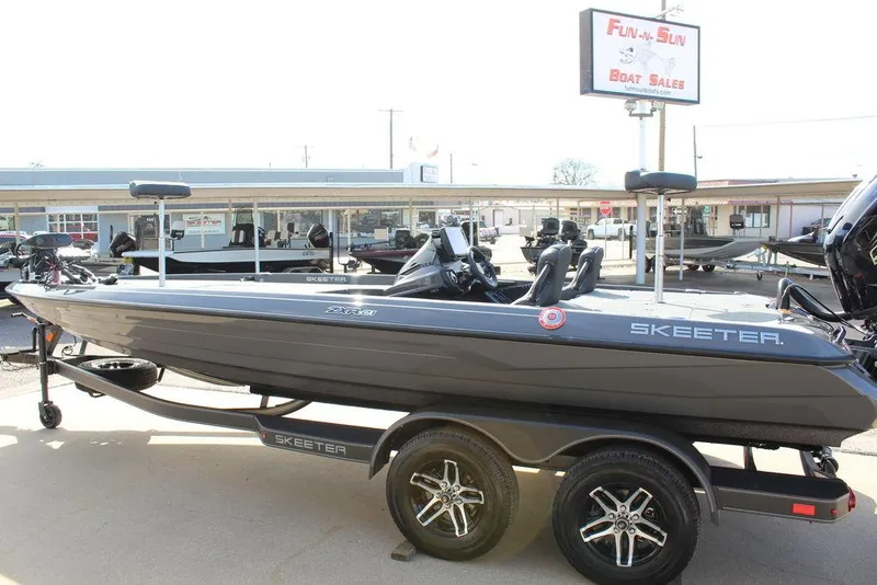 Slide: The Image of 2025 Skeeter ZXR21 boat on trailer at dealership. - 8