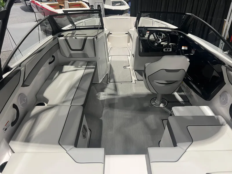 Slide: The Image of 2024 Yamaha Boats AR 220 interior with sleek seating and modern dashboard design. - 2