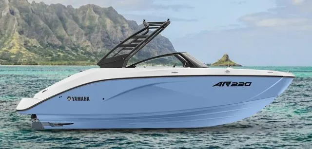 Slide: The Image of 2024 Yamaha Boats AR 220 on scenic water with mountainous backdrop. - 6