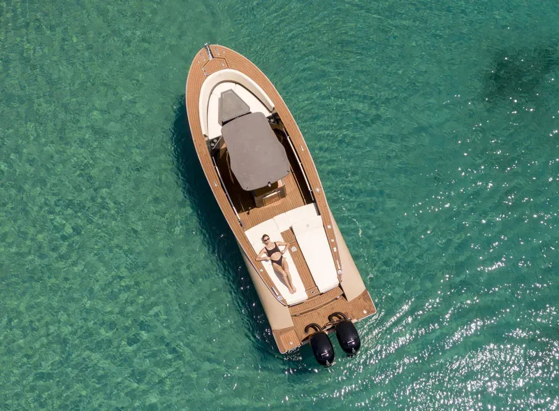 Slide: The Image of Aerial view of 2025 AlCustom Levanzo 25 boat on clear turquoise water. - 22