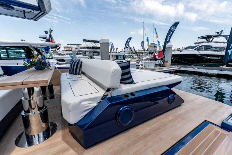 Slide: The Image of Luxurious 2023 Wally Wallytender 48 yacht interior with elegant seating and scenic marina view. - 16