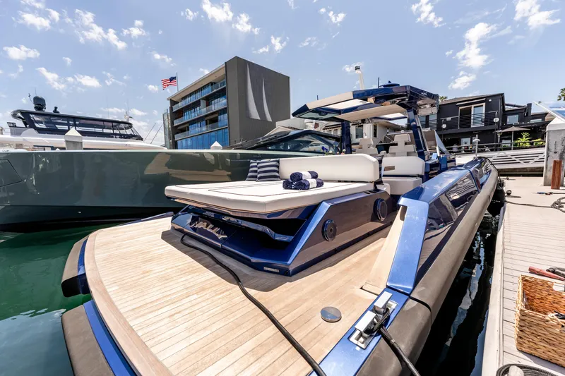 Slide: The Image of Luxury 2023 Wally Wallytender 48 yacht with sunbathing deck on serene water. - 17