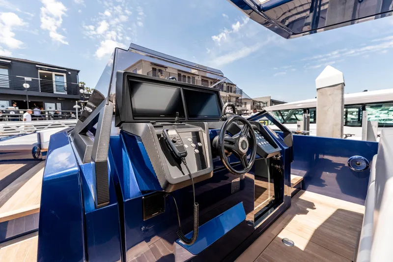 Slide: The Image of 2023 Wally Wallytender 48 yacht with elegant seating and table on open water. - 18