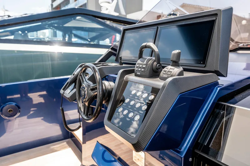 Slide: The Image of 2023 Wally Wallytender 48 luxury yacht interior with modern seating and scenic waterfront view. - 20