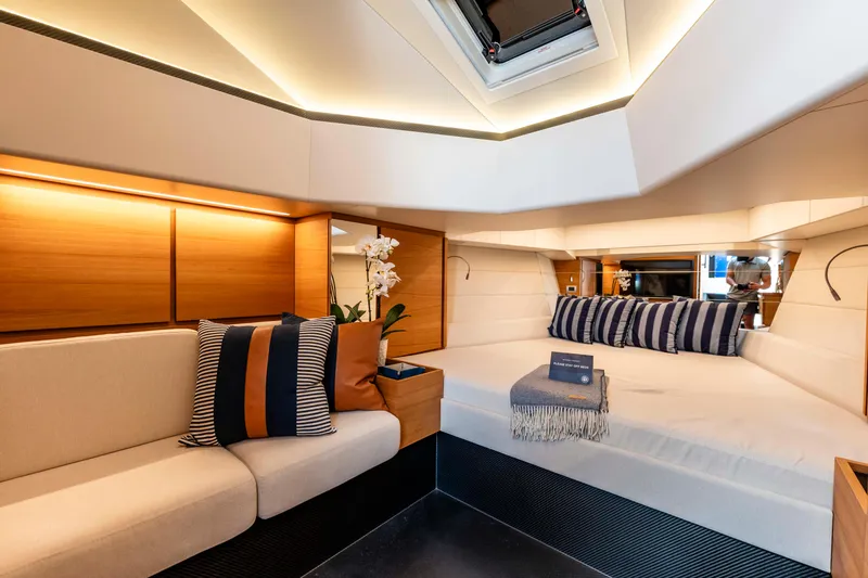 Slide: The Image of Luxurious interior of 2023 Wally Wallytender 48 yacht with elegant seating and bedding. - 28