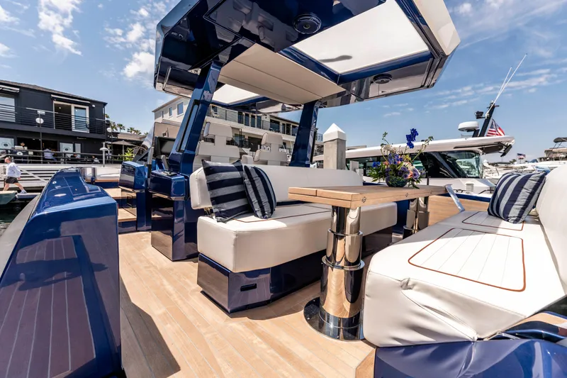 Slide: The Image of 2023 Wally Wallytender 48 yacht cruising near rocky shoreline. - 9