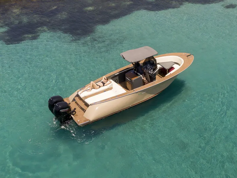 The Image of 2025 AlCustom Levanzo 25 boat on clear turquoise water, featuring dual outboard motors. - 0