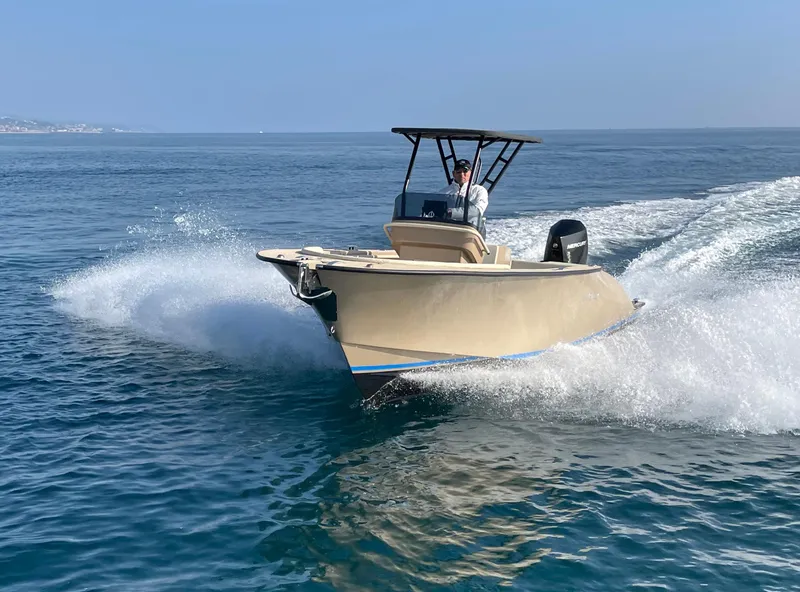 Slide: The Image of 2025 AlCustom Levanzo 25 boat cruising on open water, creating a dynamic wake. - 3