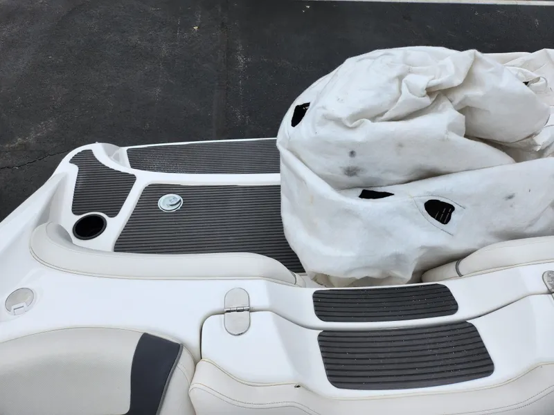 Slide: The Image of 2014 Yamaha AR190 boat deck with cover, featuring sleek design and textured flooring. - 22