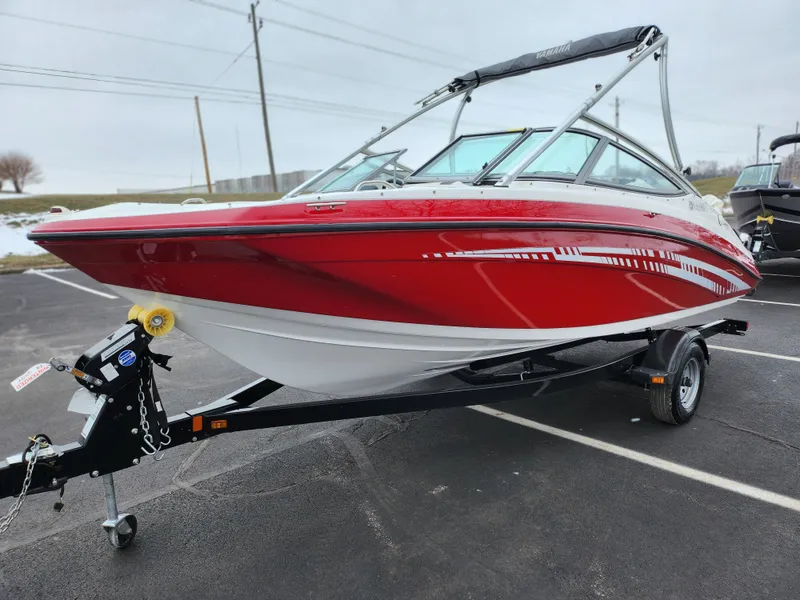 Slide: The Image of 2014 Yamaha Boats AR190, red and white, on trailer in parking lot. - 5