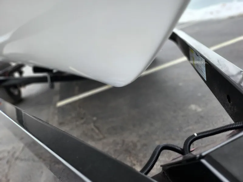 Slide: The Image of Close-up of a 2014 Yamaha AR190 boat on a trailer, highlighting the hull and frame. - 7