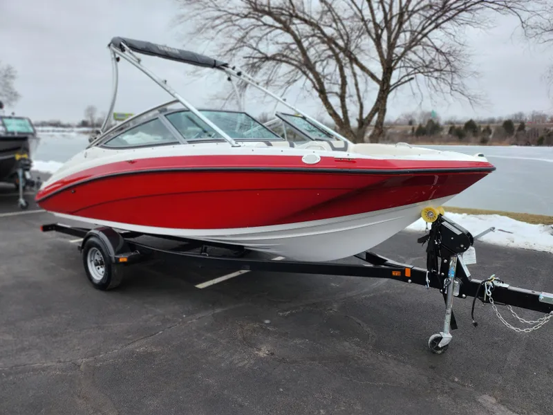 Slide: The Image of 2014 Yamaha Boats AR190, red and white, on trailer near snowy lake. - 8