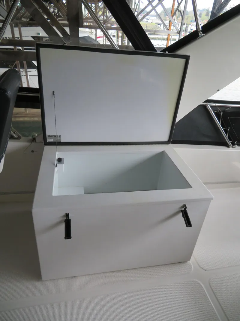 Slide: The Image of Open storage compartment on 1990 Ocean Alexander 48 Cockpit Motoryacht deck. - 37