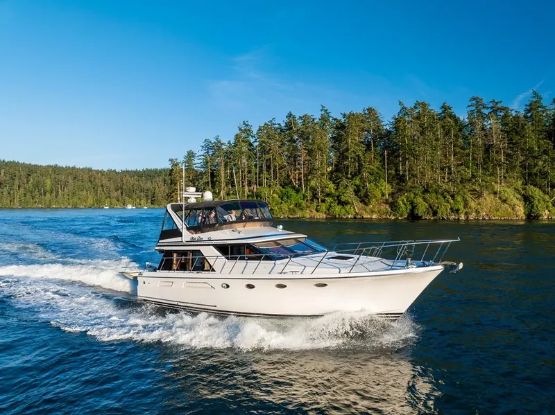 Slide: The Image of Ocean Alexander 48 Cockpit Motoryacht cruising on a scenic waterway, 1990 model. - 5