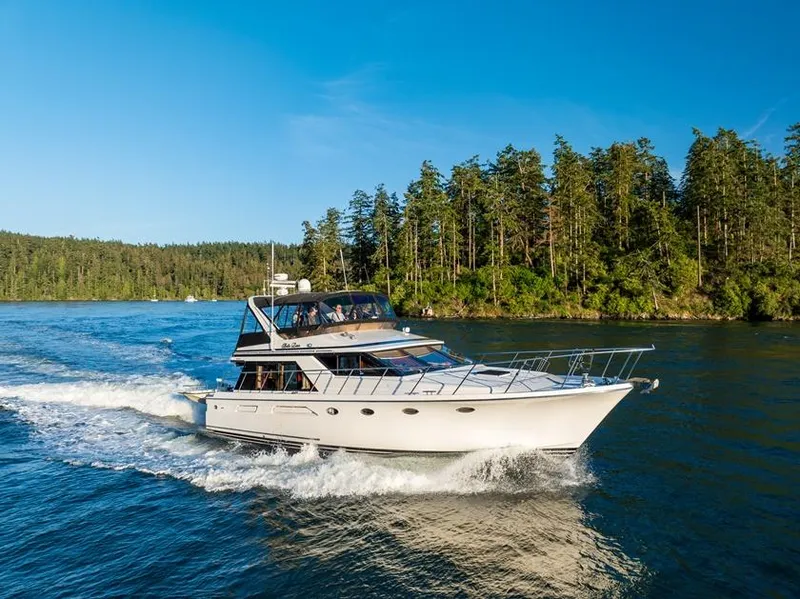 Slide: The Image of Ocean Alexander 48 Cockpit Motoryacht cruising on a scenic waterway, 1990 model. - 8