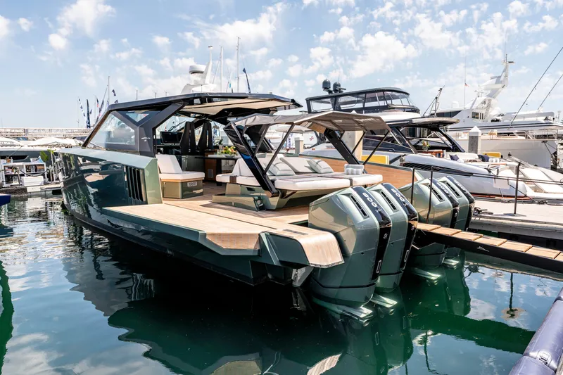 Slide: The Image of 2024 Wally WALLYPOWER 58X yacht bow with open hatch, showcasing sleek design on calm water. - 14