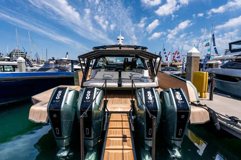 Slide: The Image of 2024 Wally WALLYPOWER 58X yacht docked, showcasing sleek design and luxurious deck. - 15