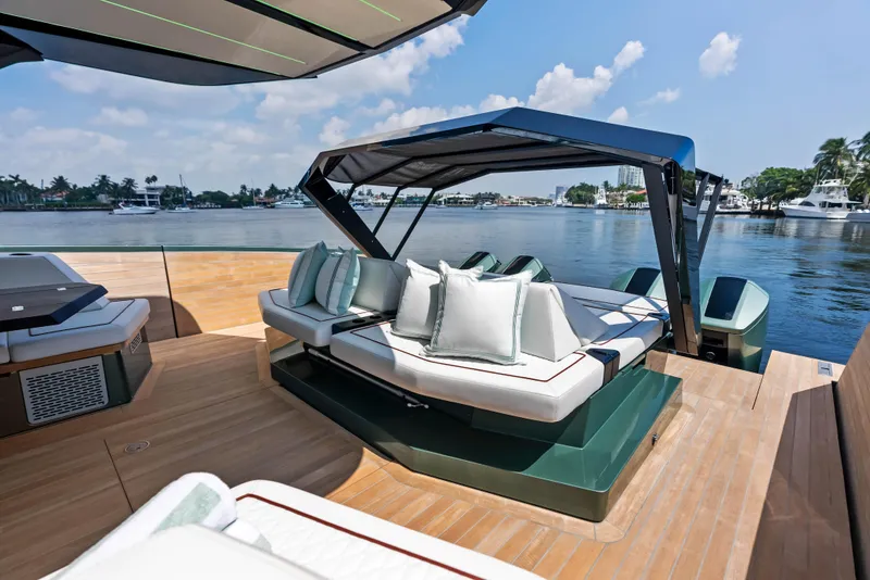 Slide: The Image of 2024 Wally WALLYPOWER 58X yacht with sun loungers and canopy, docked at marina. - 21