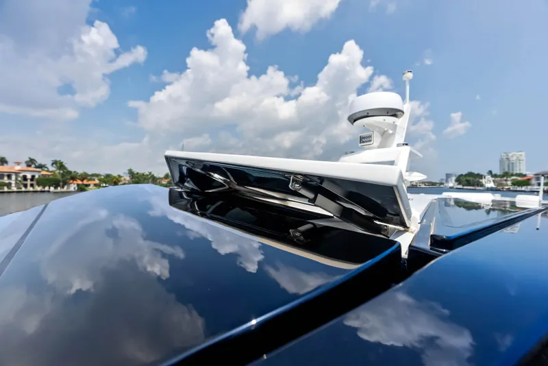 Slide: The Image of 2024 Wally WALLYPOWER 58X yacht docked near luxury waterfront homes. - 48