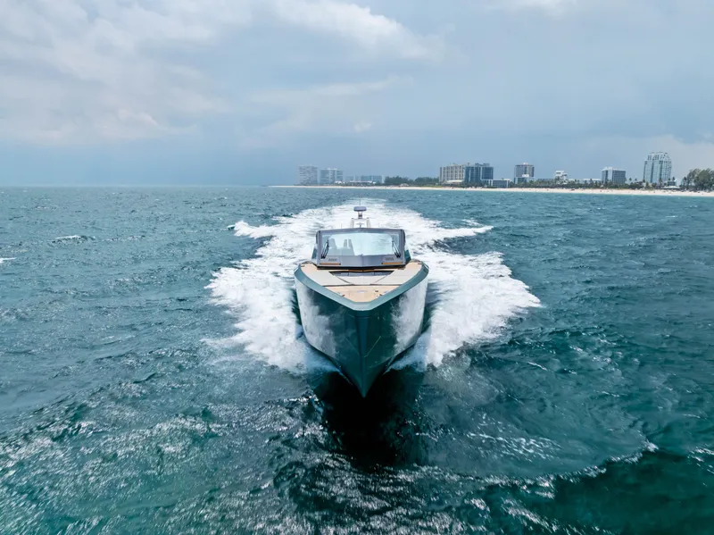 Slide: The Image of 2024 Wally WALLYPOWER 58X yacht cruising on open sea near coastline. - 58